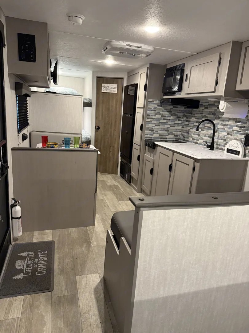 Wide view of interior galley and bunks