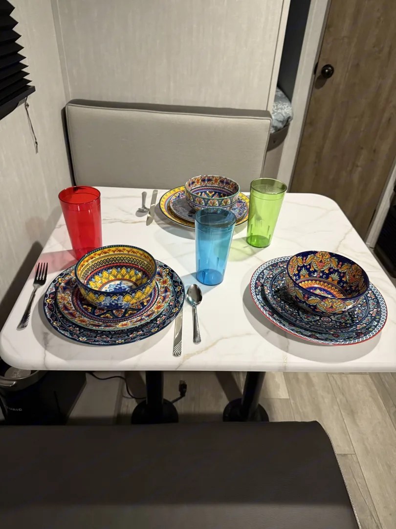 Dish set and cups on table